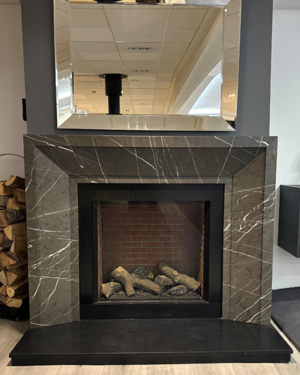 Custom-made Gianni fireplace crafted in Pietra Grey marble