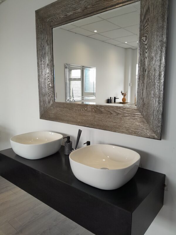 Custom-made bathroom vanity unit crafted in Black Honed granite