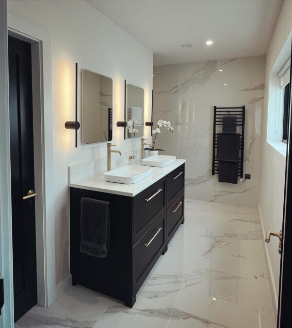 Custom-made bathroom vanity unit crafted in Crema quartz