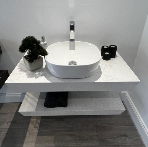 Custom bathroom vanity unit crafted in Crema quartz